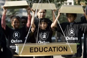 Oxfam International Stages Protest Outside World Bank And IMF