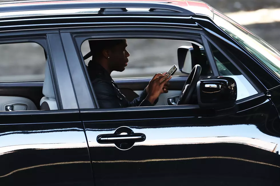 Can You Think of Songs Which Would Make Road Signs to Stop People from Looking at Their Phones While Driving?